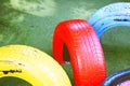 Tire chairs on green grass fake at Playground