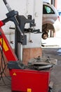 Tire changer device in an automobile repair shop Royalty Free Stock Photo