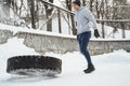 Strong sportsman during his cross training workout during snowy and cold winter day. Royalty Free Stock Photo