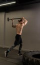 Tire muscular hammer crossfit wheel sledge man hitting gym athlete, concept strength heavy from strong from bodybuilder