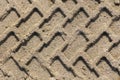 Tire pattern on sand. Royalty Free Stock Photo