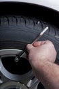 Tire pressure Guage and car tire Royalty Free Stock Photo