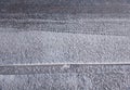 Tire print on snow asphalt texture backdrop Royalty Free Stock Photo