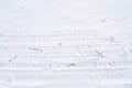 Tire print on the snow Royalty Free Stock Photo