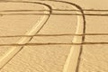 Tire prints in the desert Royalty Free Stock Photo