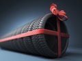 Tire with a red ribbon. Gift. 3D Icon on blue