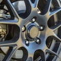 Tire rim with break pad showing between spokes