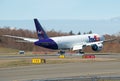 Fedex Boeing 777F Freighter Cargo airplane on touchdown Royalty Free Stock Photo