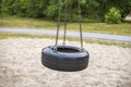 Tire swing on playground in the park Royalty Free Stock Photo