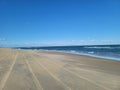 Tire track beach ocean sand outerbanks North Carolina Royalty Free Stock Photo