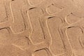 Tire track on the beach. Tire footprint in the sand Royalty Free Stock Photo