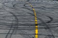 Tire track mark on asphalt tarmac road race track texture and background, Abstract background black tire tracks skid on asphalt Royalty Free Stock Photo