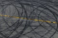 Tire track mark on asphalt tarmac road race track texture and background, Abstract background black tire tracks skid on asphalt Royalty Free Stock Photo