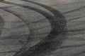 Tire track mark on asphalt tarmac road race track texture and background, Abstract background black tire tracks skid on asphalt Royalty Free Stock Photo