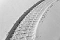 Tire track in snow Royalty Free Stock Photo