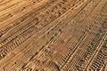 Tire track tread marks in sandy dust road Royalty Free Stock Photo