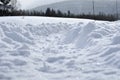 Tire tracks in deep winter snow Royalty Free Stock Photo