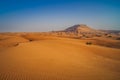Tire tracks through the desert sand dunes. Royalty Free Stock Photo