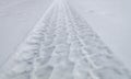 Tire tracks in freshly fallen snow in a residential neighborhood Royalty Free Stock Photo