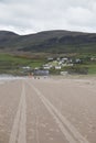 Tire tracks on Inch Beach on Dingle Peninsula, County Kerry