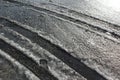 Tire tracks on the melting snow Royalty Free Stock Photo