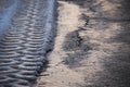 Tires tracks in melting snow Royalty Free Stock Photo