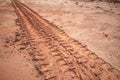 Tire tracks on a muddy road Royalty Free Stock Photo