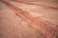 Tire tracks on a muddy road Royalty Free Stock Photo