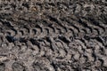 Tire tracks protector on dirt. Wheel`s trail tread, close up