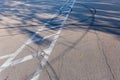 Tire tracks and road marking on the asphalt surface Royalty Free Stock Photo