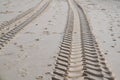 Tire tracks on sand beach desert background texture Royalty Free Stock Photo