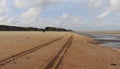 Tire tracks in the sand at Utah Beach in France Royalty Free Stock Photo