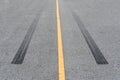 Tire tracks , Wheel trace on asphalt road Royalty Free Stock Photo