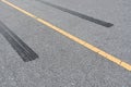 Tire tracks , Wheel trace on asphalt road Royalty Free Stock Photo