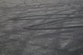 Tire tracks. wheel track on asphalt road. asphalt with traces of car wheels. Traces of braking from rubber tyres on cement. Abstra Royalty Free Stock Photo