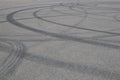 Tire tracks. wheel track on asphalt road. asphalt with traces of car wheels. Traces of braking from rubber tyres on cement. Abstra Royalty Free Stock Photo