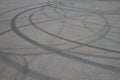 Tire tracks. wheel track on asphalt road. asphalt with traces of car wheels. Traces of braking from rubber tyres on cement. Abstra Royalty Free Stock Photo