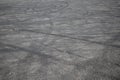 Tire tracks. wheel track on asphalt road. asphalt with traces of car wheels. Traces of braking from rubber tyres on cement. Abstra Royalty Free Stock Photo