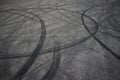 Tire tracks. wheel track on asphalt road. asphalt with traces of car wheels. Traces of braking from rubber tyres on cement. Abstra Royalty Free Stock Photo