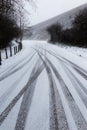 Tire trails on snow Royalty Free Stock Photo