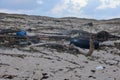 Tire and Trash Strewn Along the Coast