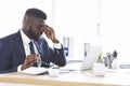 Tired african american businessman taking his glasses off Royalty Free Stock Photo