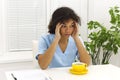 Tired african american doctor or nurse after hard working day or sleepless night shift in clinic Royalty Free Stock Photo