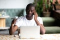 Tired African American man taking off glasses, feel eye strain Royalty Free Stock Photo