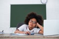 Tired african american pupil looking at Royalty Free Stock Photo