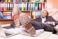 Tired african man sleeping in the office Royalty Free Stock Photo