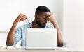 Tired african worker taking his glasses off Royalty Free Stock Photo