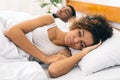 Tired and annoyed woman of her boyfriend snoring Royalty Free Stock Photo