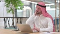 Tired Arab Businessman with Laptop having Neck Pain Royalty Free Stock Photo