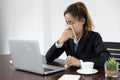 Tired asia business woman with headache at office, feeling sick at work, copy space Royalty Free Stock Photo